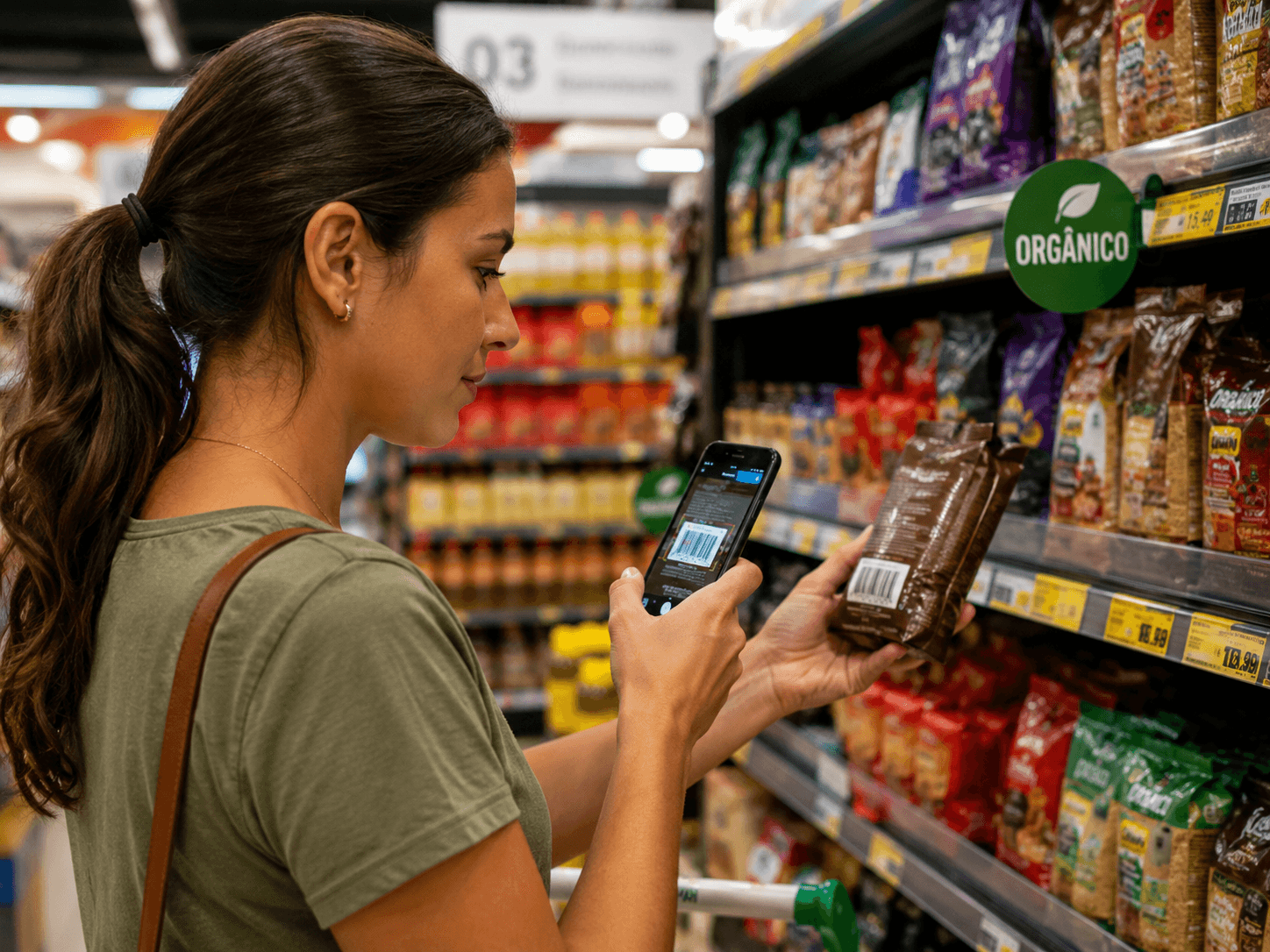 Woman scanning a product barcode at the supermarket with her phone